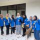 Karang Taruna RW 05 bersih-bersih aula komunitas bersama warga Tanah Baru Depok