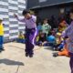 Anak-anak dan keluarga bermain permainan tradisional seperti engklek dan congklak di acara Hari Anak Nasional di Depok Open Space