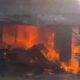 Petugas Damkar Depok memadamkan api di ruko yang terbakar di Jalan Raya Krukut, Kecamatan Limo